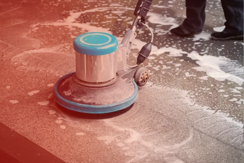 Deep cleaning a floor with scrub gloves