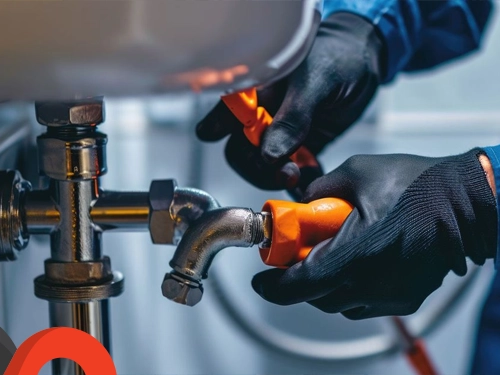 Plumber repairing a pipe